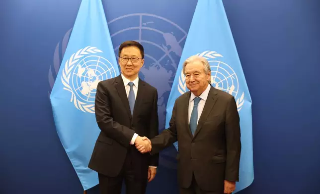 Chinese Vice President Han Zheng, left, shakes hands with United Nations Secretary-General Antonio Guterres during the 81st session of the United Nations General Assembly at United Nations headquarters, Friday, Sept. 25, 2026. (AP Photo/Heather Khalifa)