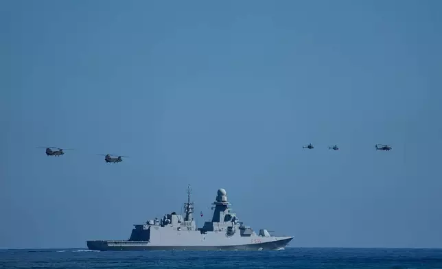 Military helicopters fly over the Italian Navy frigate Luigi Rizzo during Medusa 15, a multinational military exercise led by Greece and Egypt, at Maleme on the Greek island of Crete, Friday, Sept. 18, 2026. (AP Photo/Thanassis Stavrakis)