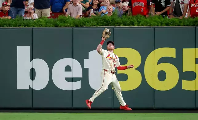 St. Louis Cardinals' Nathan Church catches a fly ball for an out against Chicago White Sox's Miguel Vargas during the seventh inning of a baseball game Saturday, Sept. 12, 2026, in St. Louis. (AP Photo/Scott Kane)