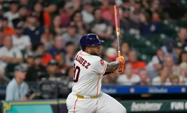 Houston Astros' Nelson Velázquez hits a two-run single against the Chicago White Sox during the eighth inning of a baseball game Wednesday, Sept. 2, 2026, in Houston. (AP Photo/David J. Phillip)