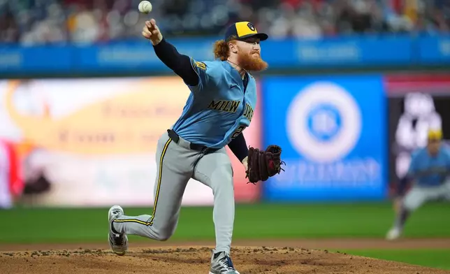 Milwaukee Brewers' Dustin May pitches during the first inning of a baseball game against the Philadelphia Phillies, Tuesday, Sept. 22, 2026, in Philadelphia. (AP Photo/Matt Rourke)