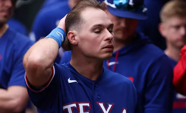 Texas Rangers' Michael Helman looks on after a baseball game against the Minnesota Twins, Sunday, Sept. 27, 2026, in Minneapolis. (AP Photo/Matt Krohn)