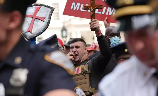 Jake Lang speaks during a protest on the 25th anniversary of the September 11, 2001, terrorist attacks, Friday, Sept. 11, 2026, in New York. (AP Photo/Angelina Katsanis)