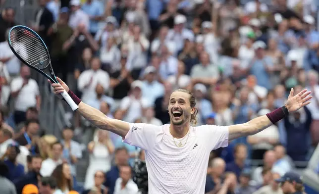 Alexander Zverev, of Germany, celebrates after he won the men's singles final of the U.S. Open tennis championships against Ben Shelton, of the United States, Sunday, Sept. 13, 2026, in New York. (AP Photo/Kirsty Wigglesworth)