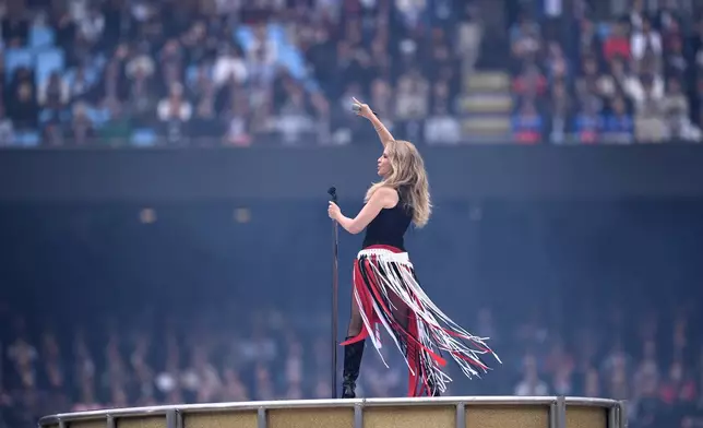 Singer Kylie Minogue performs before the start of the Australian Football League grand final between the Brisbane Lions and the Fremantle Dockers in Melbourne, Australia Saturday, Sept. 26, 2026. (Joel Carrett/AAP Image via AP)