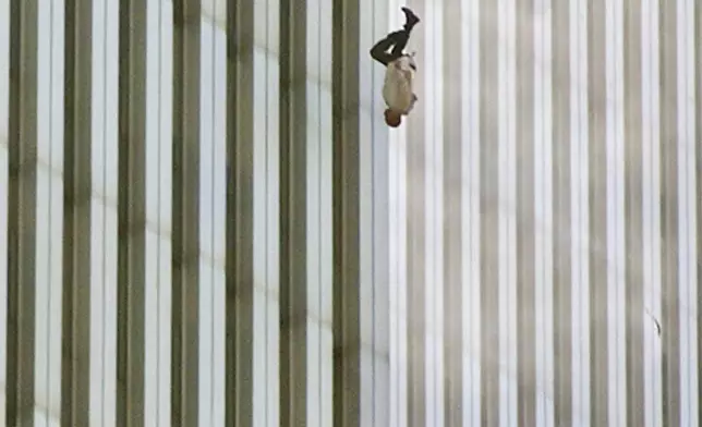 EDITORS: NOTE GRAPHIC CONTENT--- FILE - A person falls head first from the north tower of New York's World Trade Center, Sept. 11, 2001. (AP Photo/Richard Drew, File)