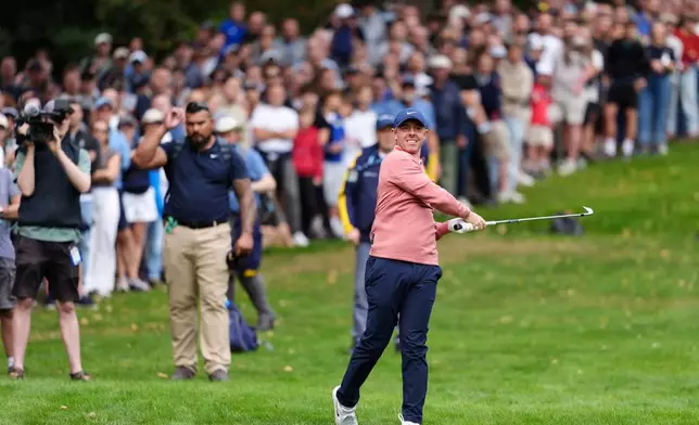 Rory McIlroy of Northern Ireland plays from the 4th fairway on day three of the PGA Championship at Wentworth Golf Club in Virginia Water, England, Saturday Sept. 19, 2026. (Adam Davy/PA via AP)