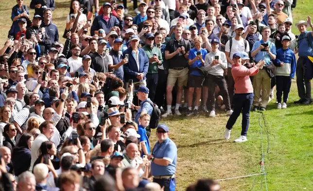 Rory McIlroy of Northern Ireland plays from the 1st fairway on day three of the PGA Championship at Wentworth Golf Club in Virginia Water, England, Saturday Sept. 19, 2026. (Adam Davy/PA via AP)
