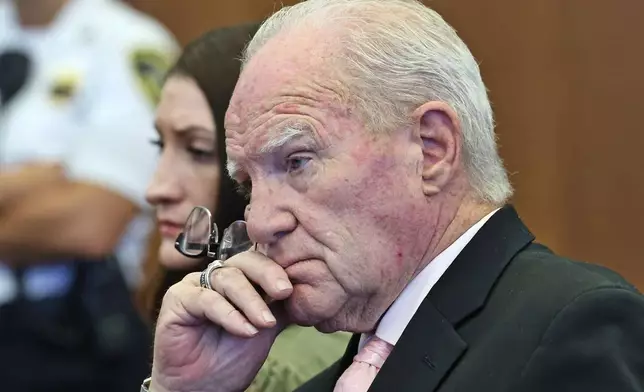 Defense attorney Kevin Reddington and defendant Lindsay Clancy listen to Judge William Sullivan speak with the jury after declaring a mistrial at court in Plymouth, Mass., on Friday, Sept. 4, 2026. (Greg Derr/The Patriot Ledger via AP, Pool)