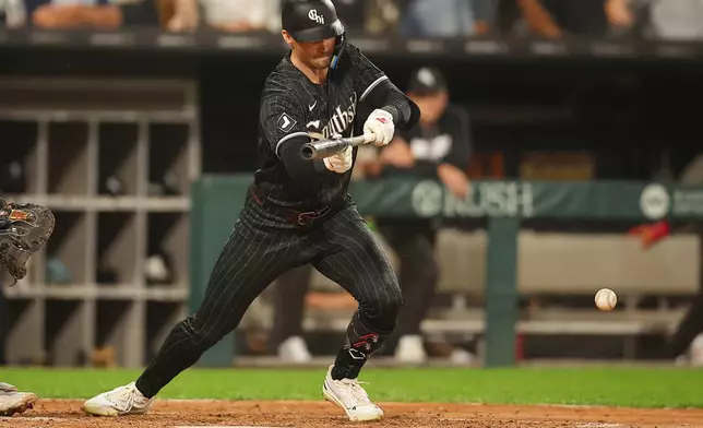 Chicago White Sox's Brenton Doyle bunts during the sixth inning of a baseball game against the Detroit Tigers, Thursday, Sept. 17, 2026, in Chicago. (AP Photo/Melissa Tamez)