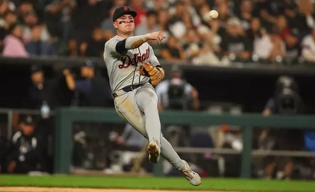 Detroit Tigers' Kevin McGonigle throws to first late as Chicago White Sox's Brenton Doyle bunt single during the sixth inning of a baseball game, Thursday, Sept. 17, 2026, in Chicago. (AP Photo/Melissa Tamez)