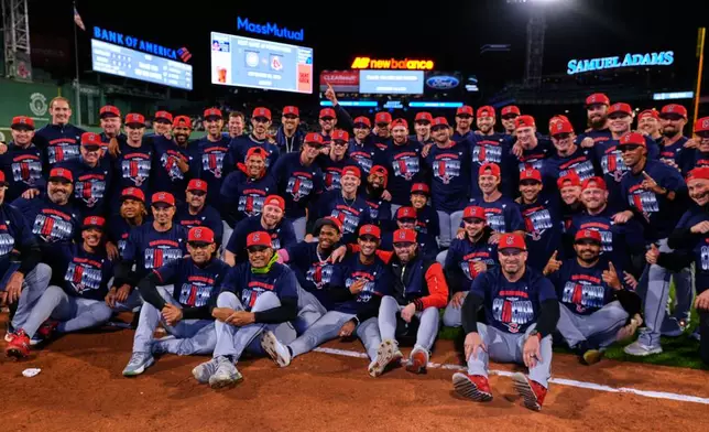 Cleveland Guardians pose on the field at Fenway Park after clinching a post season playoff spot following a baseball game against the Boston Red Sox, Thursday, Sept. 24, 2026, in Boston. (AP Photo/Charles Krupa)