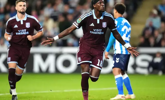 Aston Villa's Tammy Abraham, centre, celebrates scoring their side's third goal during the English League Cup third round soccer match between Coventry City and Aston Villa in Coventry, England, Wednesday, Sept. 16, 2026. (Nick Potts/PA via AP)