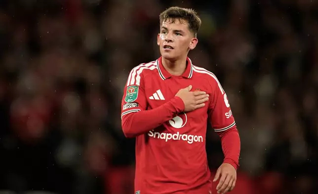 Manchester United's Shea Lacey celebrates after scoring the opening goal during the English League Cup third round soccer match between Manchester United and Brighton and Hove Albion in Manchester, England, Wednesday, Sept. 16, 2026. (AP Photo/Dave Thompson)