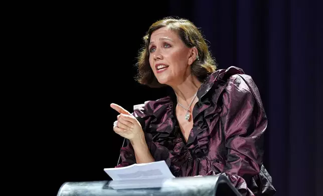 Maggie Gyllenhaal speaks to the audience prior to Ellen Burstyn receiving the golden lion for lifetime achievement during the 83rd edition of the Venice Film Festival in Venice, Italy, on Monday, Sept. 7, 2026. (Photo by Scott A Garfitt/Invision/AP)