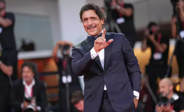 Adriano Giannini poses for photographers at the red carpet for the film 'L'Estranea' during the 83rd edition of the Venice Film Festival in Venice, Italy, on Monday, Sept. 7, 2026. (Photo by Scott A Garfitt/Invision/AP)