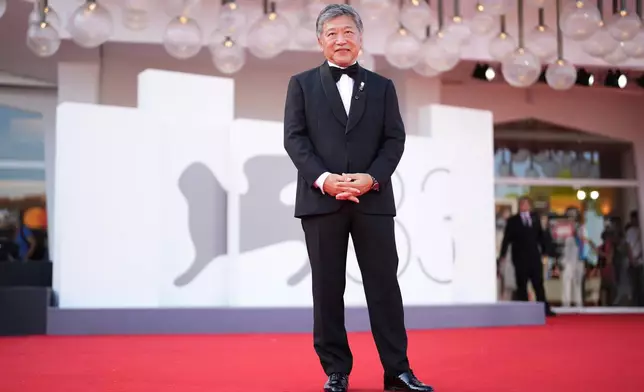 Director Hirokazu Kore-eda poses for photographers at the red carpet for the film 'Look Back' during the 83rd edition of the Venice Film Festival in Venice, Italy, on Monday, Sept. 7, 2026. (Photo by Scott A Garfitt/Invision/AP)