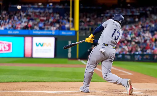 Tampa Bay Rays' Junior Caminero hits a two-run home run during the first inning of a baseball game against the Philadelphia Phillies, Saturday, Sept. 26, 2026, in Philadelphia. (AP Photo/Chris Szagola)