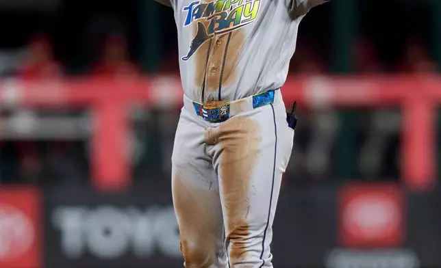 Tampa Bay Rays' Yandy Diaz reacts after his double during the first inning of a baseball game against the Philadelphia Phillies, Saturday, Sept. 26, 2026, in Philadelphia. (AP Photo/Chris Szagola)
