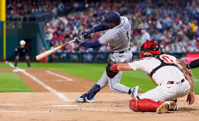 Tampa Bay Rays' Richard Palacios hits an RBI double during the first inning of a baseball game against the Philadelphia Phillies, Saturday, Sept. 26, 2026, in Philadelphia. (AP Photo/Chris Szagola)