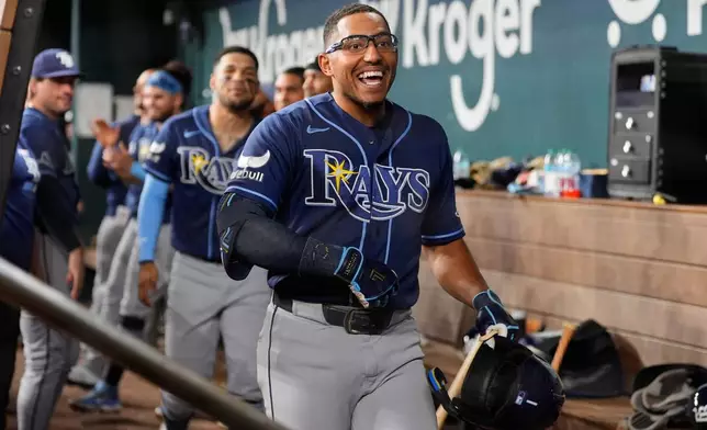 Tampa Bay Rays' Richie Palacios celebrates his solo home run with the team during the fourth inning of a baseball game against the Texas Rangers Friday, Sept. 4, 2026, in Arlington, Texas. (AP Photo/Tony Gutierrez)