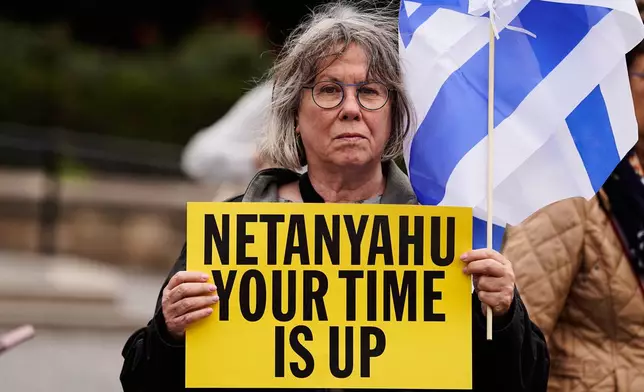 A person holds a sign during a protest ahead of Israeli Prime Minister Benjamin Netanyahu's address at the 81st session of the United Nations General Assembly, Thursday, Sept. 24, 2026, in New York. (AP Photo/Madison Swart)