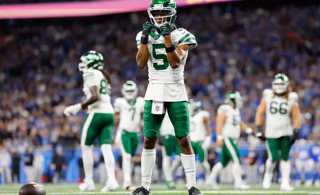 New York Jets' Garrett Wilson celebrates a touchdown catch during the second half of an NFL football game against the Detroit Lions in Detroit, Sunday, Sept. 27, 2026. (AP Photo/Ray Del Rio)