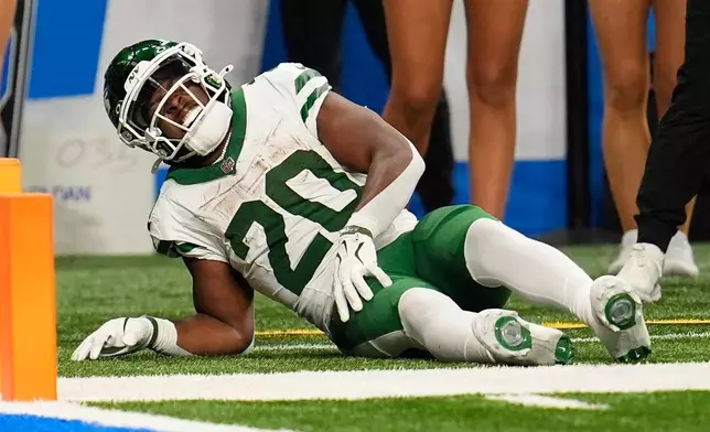 New York Jets' Breece Hall is injured during the second half of an NFL football game against the Detroit Lions in Detroit, Sunday, Sept. 27, 2026. (AP Photo/Paul Sancya)