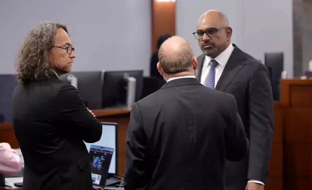 Defense attorney Michael Sanft, left, and Chief Deputy District Attorneys Marc DiGiacomo, center, and Binu Palal confer in the courtroom before closing arguments in the Duane Davis murder trial, related to the 1996 killing of rapper Tupac Shakur, in Clark County District Court at the Regional Justice Center in Las Vegas, Monday, Aug. 31, 2026. (Steve Marcus/Pool Photo via AP)