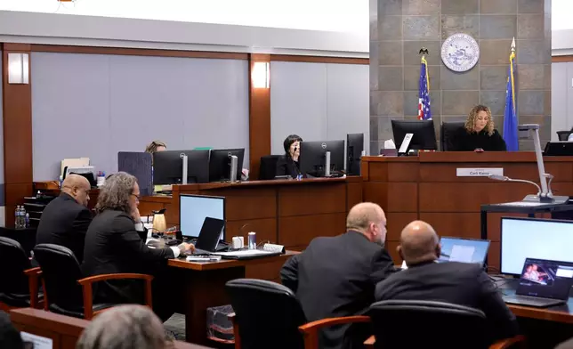 District Court Judge Carli Kierny, top right, reads jury instructions before closing arguments in the Duane Davis murder trial, related to the 1996 killing of rapper Tupac Shakur, in Clark County District Court at the Regional Justice Center in Las Vegas, Monday, Aug. 31, 2026. (Steve Marcus/Pool Photo via AP)