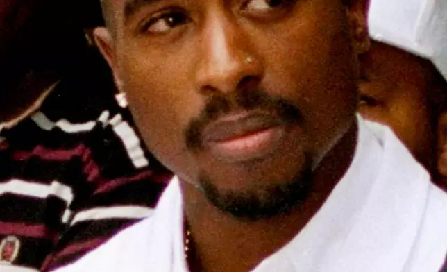 FILE - Rapper Tupac Shakur attends a voter registration event in South Central Los Angeles, Aug. 15, 1996. (AP Photo/Frank Wiese, File)