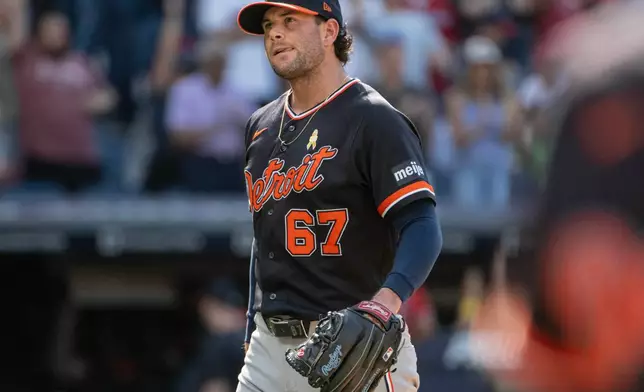 Detroit Tigers relief pitcher Kyle Finnegan reacts after giving up the winning single to Cleveland Guardians' Daniel Schneemann in the 10th inning of a baseball game, Sunday, Sept. 6, 2026, in Cleveland. (AP Photo/Phil Long)
