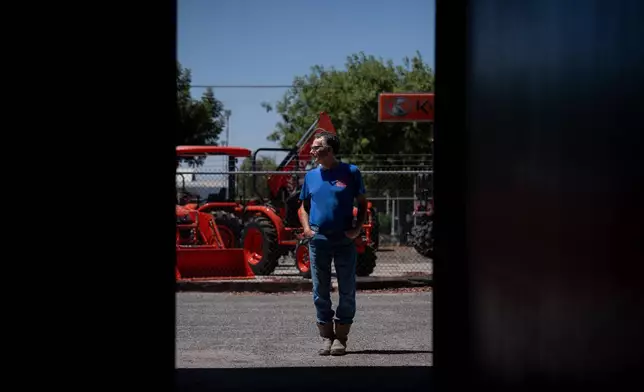 Scott Alcoser, a parts manager at a farm equipment retailer, stands for a photo in Hanford, Calif., Friday, Aug. 21, 2026. (AP Photo/Jae C. Hong)