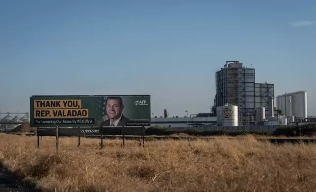 A billboard thanking U.S. Rep. David Valadao, R-Calif., stands near a dairy facility in Pixley, Calif., Friday, Aug. 21, 2026. (AP Photo/Jae C. Hong)