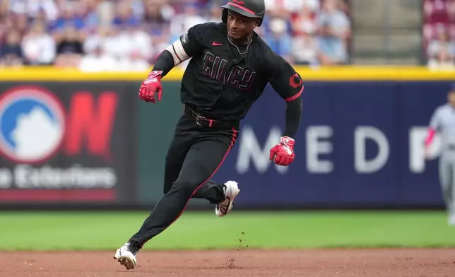 Cincinnati Reds' Carlos Jorge advances to third base after hitting a triple during the first inning of a baseball game against the Chicago Cubs, Friday, Sept. 18, 2026, in Cincinnati. (AP Photo/Kareem Elgazzar)