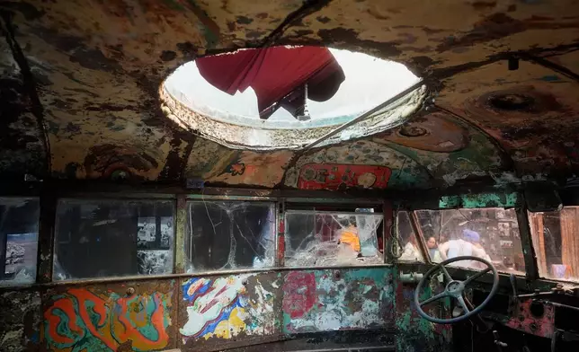 The interior of Ken Kesey's psychedelic bus "Furthur" is shown while displayed at the Forever Grateful exhibit presented by the Haight Street Art Center at the County Fair Building in Golden Gate Park, Tuesday, Sept. 1, 2026, in San Francisco. (AP Photo/Jeff Chiu)