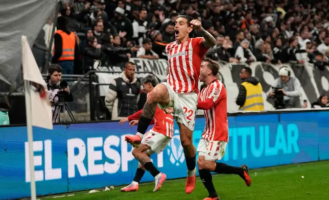 Alexis Castro of Argentina's Estudiantes de La Plata, center, celebrates after scoring his side's opening goal against Brazil's Corinthians during the second leg of a Copa Libertadores quarterfinal soccer match in Sao Paulo, Brazil, Wednesday, Sept. 16, 2026. (AP Photo/Andre Penner)