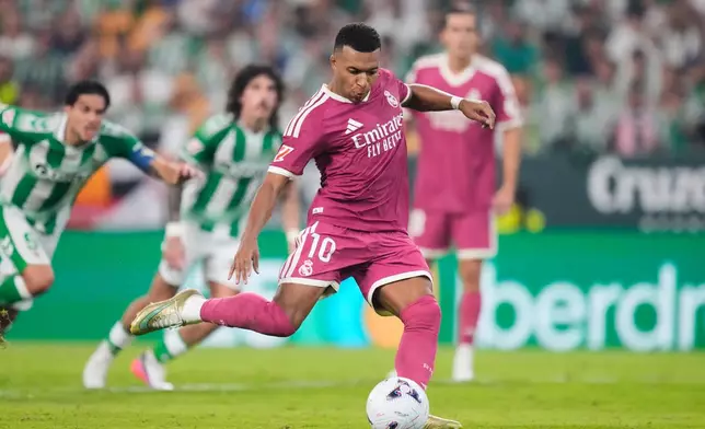 Real Madrid's Kylian Mbappe fails a chance to score from the penalty spot during the Spanish La Liga soccer match between Real Betis and Real Madrid in Seville, Spain, Friday, Sept. 4, 2026. (AP Photo/Jose Breton)