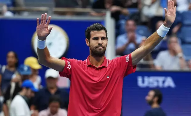 Karen Khachanov, of Russia, celebrates on the court after winning a match against Alexander Blockx, of Belgium, during the quarterfinal round of the U.S. Open tennis championships, Wednesday, Sept. 9, 2026, in New York. (AP Photo/Kirsty Wigglesworth)