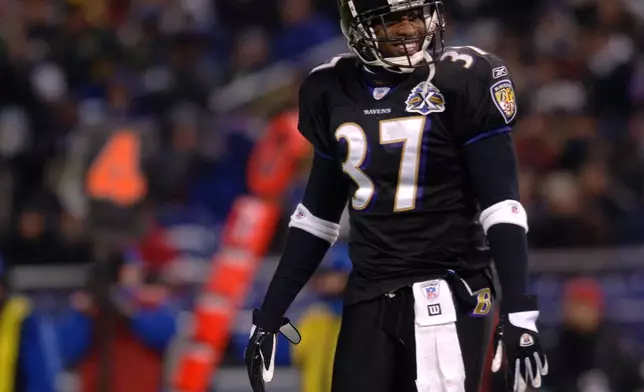 FILE - Baltimore Ravens cornerback Deion Sanders smiles during the third quarter of a football game against the Green Bay Packers, Dec. 19, 2005, in Baltimore. (AP Photo/Gail Burton, File)