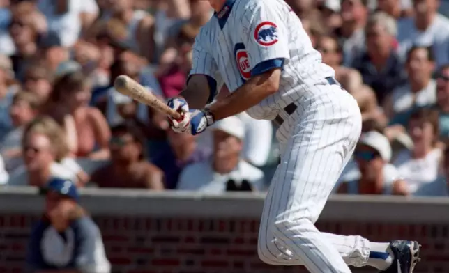 FILE - Chicago Cubs Ryne Sandberg watches his home run ball against the Los Angeles Dodgers in the second inning, Aug. 2, 1997, in Chicago. (AP Photo/Michael Conroy, File)