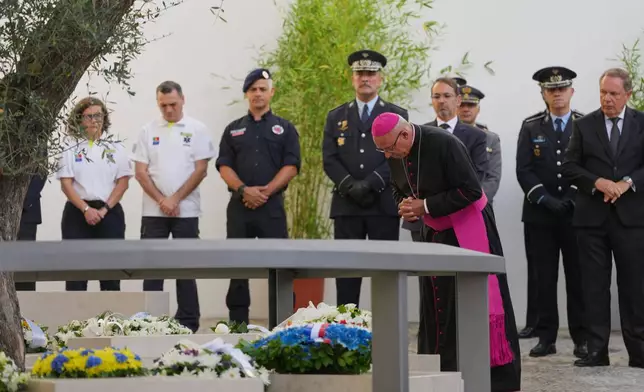 Lisbon patriarch bishop Rui Valério attends the inauguration of a memorial to the 16 people killed in the derailment and crash of Lisbon's Glória funicular, an iconic streetcar, on the first anniversary of the accident, Thursday, Sept. 3, 2026. (AP Photo/Armando Franca)