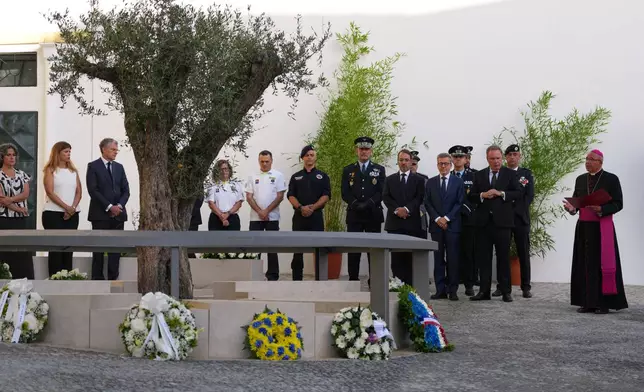 Religious, military and political officials attend the inauguration of a memorial to the 16 people killed in the derailment and crash of Lisbon's Glória funicular, an iconic streetcar, on the first anniversary of the accident, Thursday, Sept. 3, 2026. (AP Photo/Armando Franca)
