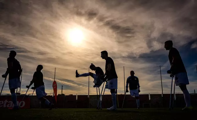 FCSB's players warm-up before an amputee soccer match between FCSB and AFAS in the inaugural EAFF Conference League in Bucharest, Romania, Thursday, Sept. 24, 2026. (AP Photo/Andreea Alexandru)