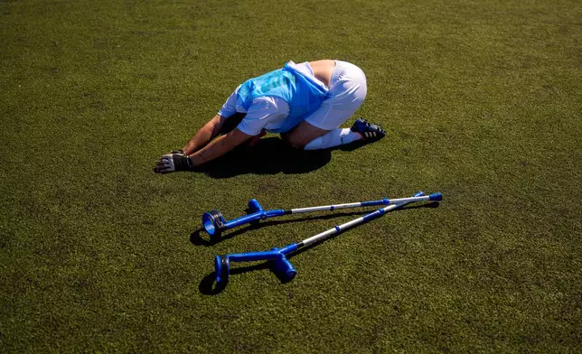 Panathinaikos' Vasileios Gogolos stretches during an amputee soccer match between Maccabi Haifa and Panathinaikos in the inaugural EAFF Conference League in Bucharest, Romania, Thursday, Sept. 24, 2026. (AP Photo/Andreea Alexandru)
