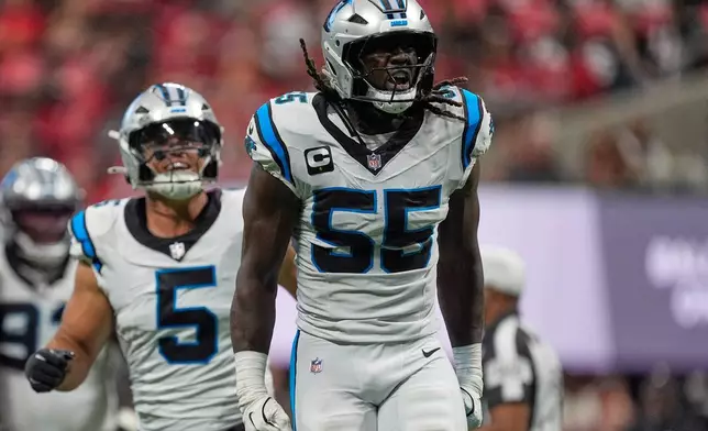 Carolina Panthers linebacker Devin Lloyd (55) celebrates after sacking Atlanta Falcons quarterback Cooper Rush (13) during an NFL football game in Atlanta, Sunday, Sept. 20, 2026. (AP Photo/Mike Stewart)