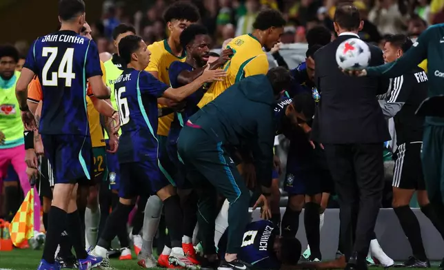 Players scuffle on the side lines during the international friendly soccer match between Australia and Brazil in Brisbane, Australia, on Tuesday, Sept. 29, 2026. (AP Photo/Tertius Pickard)
