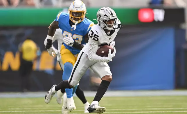 Las Vegas Raiders cornerback Hezekiah Masses (35) intercepts a pass intended for Los Angeles Chargers tight end David Njoku during the first half of an NFL football game in Inglewood, Calif., Sunday, Sept. 20, 2026. (AP Photo/Katie Chin)
