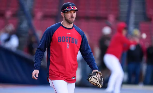 Boston Red Sox manager Chad Tracy walks on the field during batting practice prior to a baseball game against the Cleveland Guardians, Tuesday, Sept. 22, 2026, in Boston. (AP Photo/Charles Krupa)