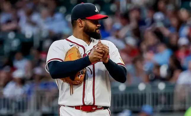 Atlanta Braves pitcher Reynaldo López rubs up a new ball after giving up a solo home run to Tampa Bay Rays' Victor Mesa Jr. during the second inning of a baseball game, Wednesday, Sept. 9, 2026, in Atlanta. (AP Photo/Erik S. Lesser)